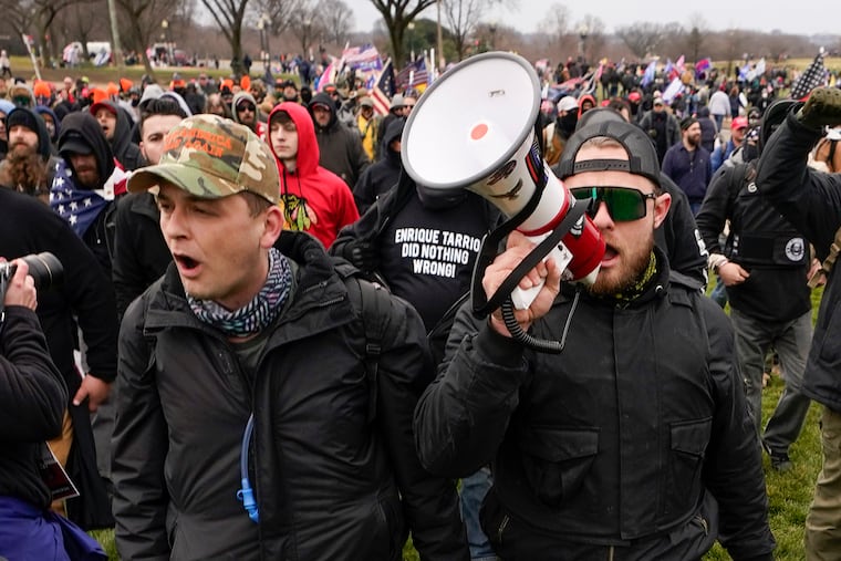 Philly Proud Boys president Zachary Rehl, left, and Ethan Nordean, a regional leader of the organization, march toward the U.S. Capitol in Washington, in support of President Donald Trump, on Jan. 6, 2021.