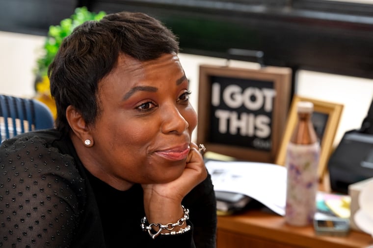 Ayanna Greene-Davis, the executive director of the Office of Victim Advocacy and Engagement, in her office with inspirational signs at the Philadelphia Police Department headquarters.