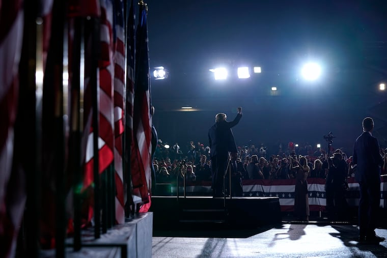 President Donald Trump gestures to the crowd after speaking during a campaign rally at the Harrisburg airport on Saturday.
