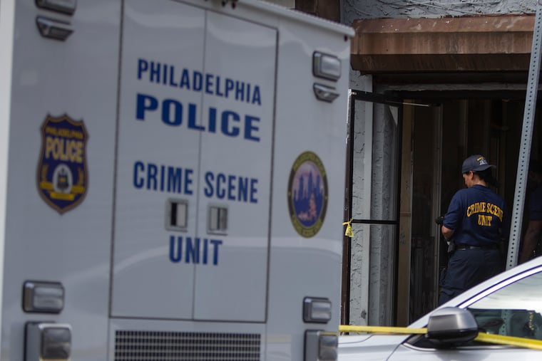 Philadelphia Police and the crime scene unit investigate a shooting that occurred on the 2300 block of Ridge Ave. in Northwest Philadelphia on Saturday, June 15, 2019.